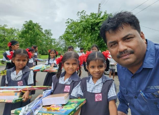 Children holding school books